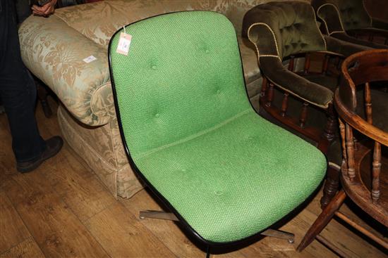 A green upholstered swivel chair